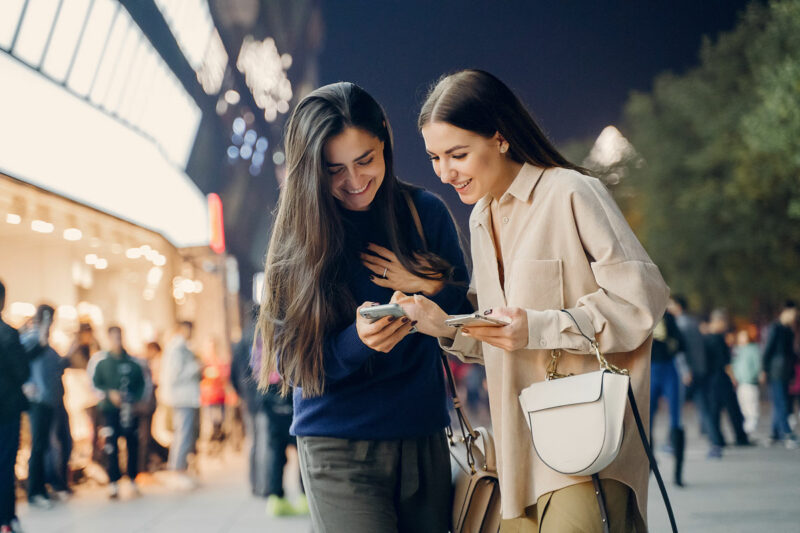 Shine Bright in Local Search: SEO Tips for UK Jewellers two girls using mobile phone