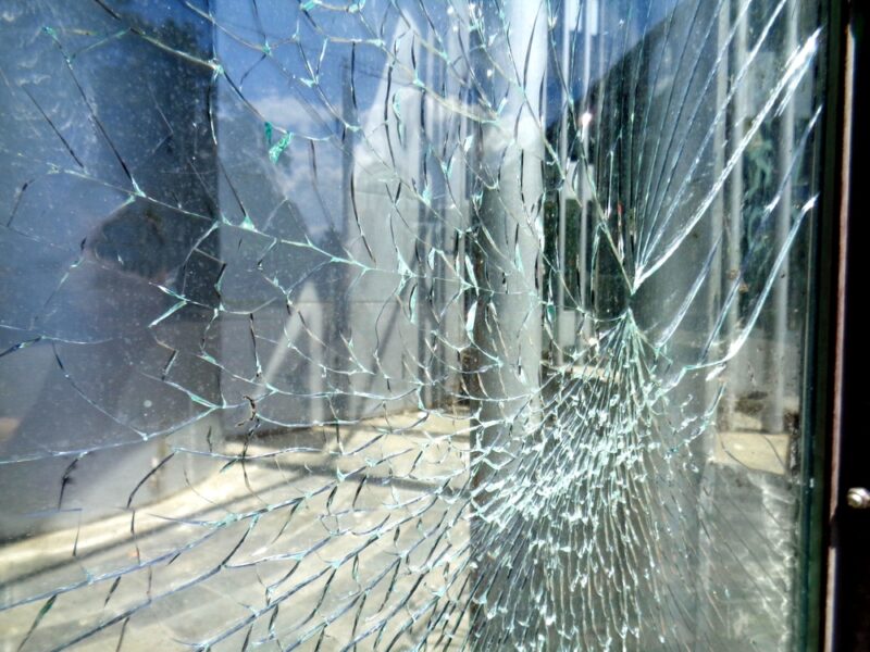broken,window,shop,glass,door,with,smashed,glass,and,empty
